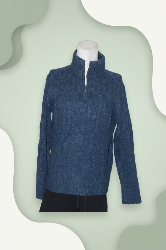 Blue textured sweater on a white mannequin against a white background