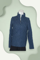 Blue textured sweater on a white mannequin against a white background